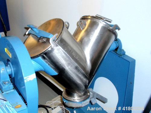 Used Patterson Kelly Twin Shell Blender, 1 cubic foot capacity, stainless steel. Maximum material density 500 pounds per cubic foot. (2) 10" diameter charge ports with quick release covers. Shell dri...