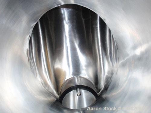Used Patterson Kelly Twin Shell Blender, 1 cubic foot capacity, stainless steel. Maximum material density 500 pounds per cubic foot. (2) 10" diameter charge ports with quick release covers. Shell dri...