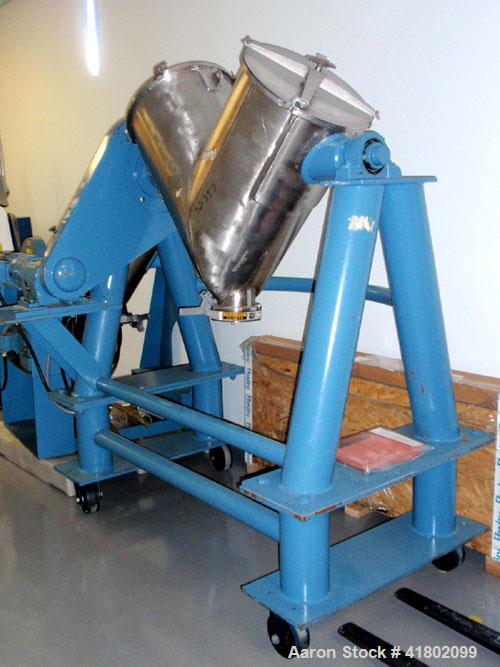 Used Patterson Kelly Twin Shell Blender, 5 Cubic Feet Capacity, Stainless Steel. Maximum material density 250 pounds per cubic foot. (2) Charge ports with quick release covers. Shell driven by a 1-1/...