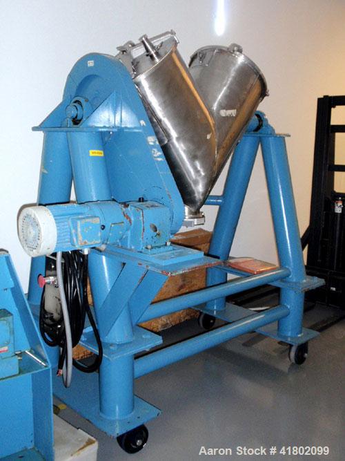 Used Patterson Kelly Twin Shell Blender, 5 Cubic Feet Capacity, Stainless Steel. Maximum material density 250 pounds per cubic foot. (2) Charge ports with quick release covers. Shell driven by a 1-1/...
