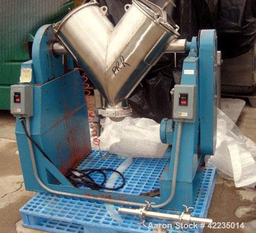 Used Patterson-Kelley Twin Shell Dry Blender, 2 Cubic Feet, Stainless Steel. Maximum material density 60 pounds per cubic foot. 14" diameter cones with quick release covers. Shell driven by an approx...