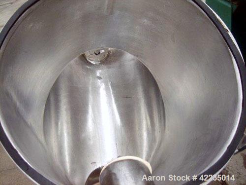 Used Patterson-Kelley Twin Shell Dry Blender, 2 Cubic Feet, Stainless Steel. Maximum material density 60 pounds per cubic foot. 14" diameter cones with quick release covers. Shell driven by an approx...