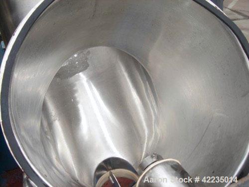 Used Patterson-Kelley Twin Shell Dry Blender, 2 Cubic Feet, Stainless Steel. Maximum material density 60 pounds per cubic foot. 14" diameter cones with quick release covers. Shell driven by an approx...