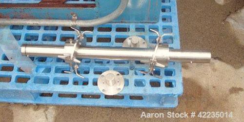 Used Patterson-Kelley Twin Shell Dry Blender, 2 Cubic Feet, Stainless Steel. Maximum material density 60 pounds per cubic foot. 14" diameter cones with quick release covers. Shell driven by an approx...