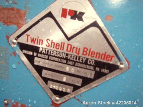 Used Patterson-Kelley Twin Shell Dry Blender, 2 Cubic Feet, Stainless Steel. Maximum material density 60 pounds per cubic foot. 14" diameter cones with quick release covers. Shell driven by an approx...