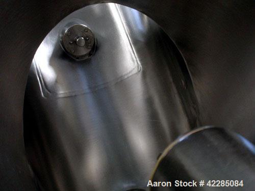 Used Patterson Kelley Twin Shell Blender, 2 Cubic Foot. Stainless steel construction, rated 195 lbs/cu. ft. max material density, standard access ports with covers, with 3/4 HP 230/460 volt shell dri...