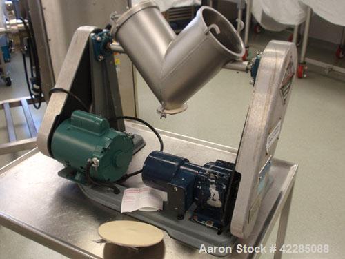 Used Patterson Kelley Twin Shell Blender, 4 Quart. Stainless steel construction. 150 lbs/cu. ft. max material density. Standard access ports with covers, pin bar driven by a 1/4 HP 115/230 volt, shel...