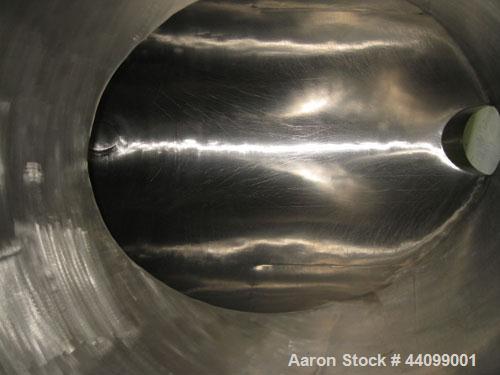 Used Patterson-Kelley Twin Shell Dry Blender, 20 Cubic Feet, Stainless Steel. 55 Pounds a cubic foot maximum material density, standard charge ports with covers, 6" discharge. Approximate 7.5 hp, 230...