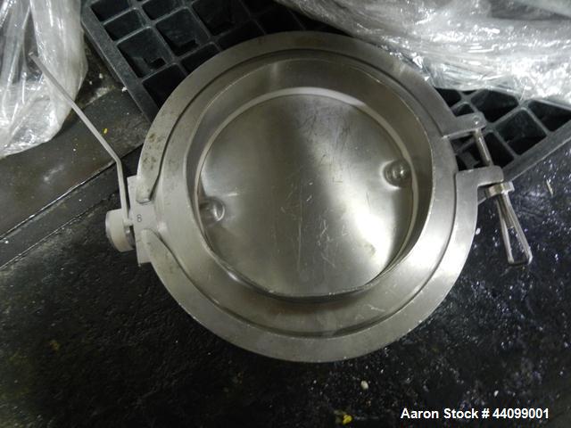 Used Patterson-Kelley Twin Shell Dry Blender, 20 Cubic Feet, Stainless Steel. 55 Pounds a cubic foot maximum material density, standard charge ports with covers, 6" discharge. Approximate 7.5 hp, 230...