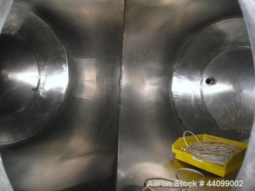Used Patterson-Kelley Twin Shell Dry Blender, 20 Cubic Feet, Stainless Steel. 65 Pounds a cubic foot maximum material density, standard charge ports with covers, 6" discharge. Approximate 5 hp, 230/4...