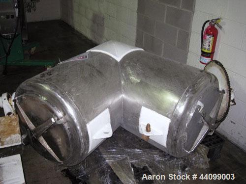 Used Patterson-Kelley Twin Shell Dry Blender, 10 Cubic Feet, Stainless Steel. 90 Pounds a cubic foot maximum material density, standard charge ports with covers, 6" discharge. Approximate 1.5hp, 230/...