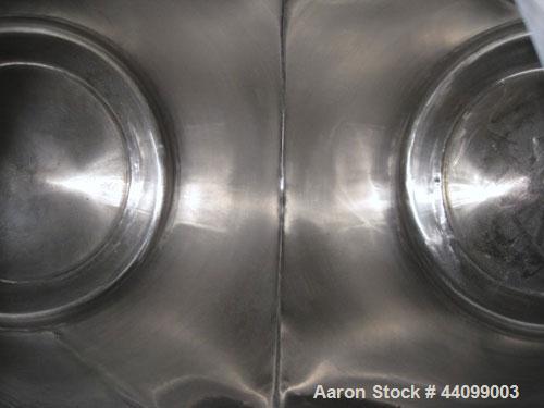 Used Patterson-Kelley Twin Shell Dry Blender, 10 Cubic Feet, Stainless Steel. 90 Pounds a cubic foot maximum material density, standard charge ports with covers, 6" discharge. Approximate 1.5hp, 230/...