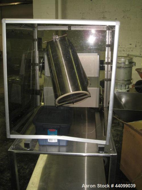 Used Patterson-Kelley Twin Shell Blender, 16 Quart, Stainless Steel. Rated 125/140 pounds a cubic foot maximum material density, with liquid feed bar, plastic enclosure with both shell and bar drives...