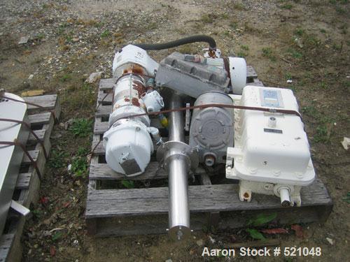 USED: 20 cu ft Patterson Kelley twin shell blender, stainless steelconstruction. Rated 65#/cu ft max material density, with liquid feedintensifier bar with drive and main drive on stands.