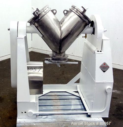 Used Patterson-Kelley Twin Shell Liquid-Solids Blender, 1 Cubic Foot Capacity, 304 Stainless Steel. Maximum material density 60 pounds per cubic foot. Solids bar with spray nozzle, driven by a 2hp, 3...