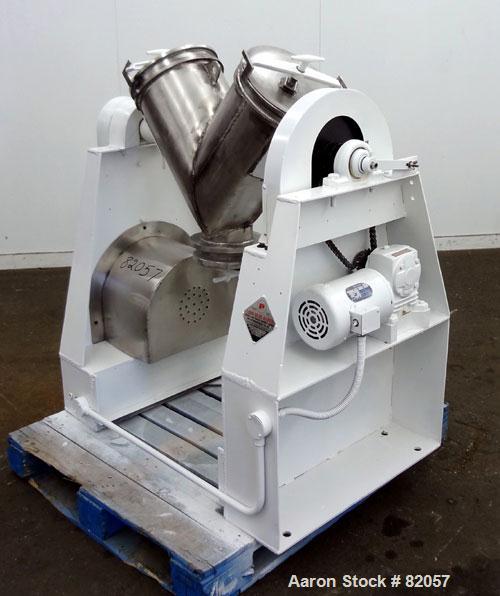 Used Patterson-Kelley Twin Shell Liquid-Solids Blender, 1 Cubic Foot Capacity, 304 Stainless Steel. Maximum material density 60 pounds per cubic foot. Solids bar with spray nozzle, driven by a 2hp, 3...