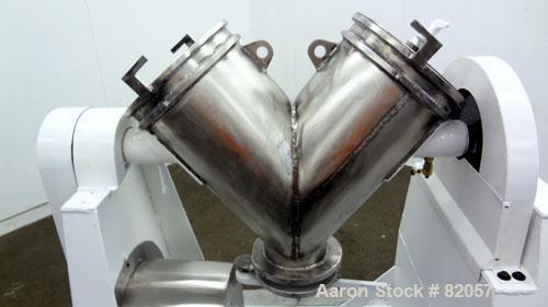 Used Patterson-Kelley Twin Shell Liquid-Solids Blender, 1 Cubic Foot Capacity, 304 Stainless Steel. Maximum material density 60 pounds per cubic foot. Solids bar with spray nozzle, driven by a 2hp, 3...