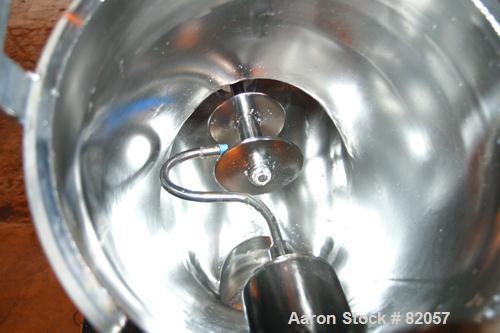 Used Patterson-Kelley Twin Shell Liquid-Solids Blender, 1 Cubic Foot Capacity, 304 Stainless Steel. Maximum material density 60 pounds per cubic foot. Solids bar with spray nozzle, driven by a 2hp, 3...