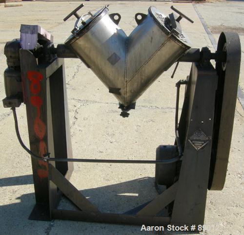 USED: Patterson Kelley twin shell liquid solids blender, 1 cubic foot working capacity, 304 stainless steel. Max material density 70 pounds per cubic foot. (2) 11" diameter charge ports with quick re...