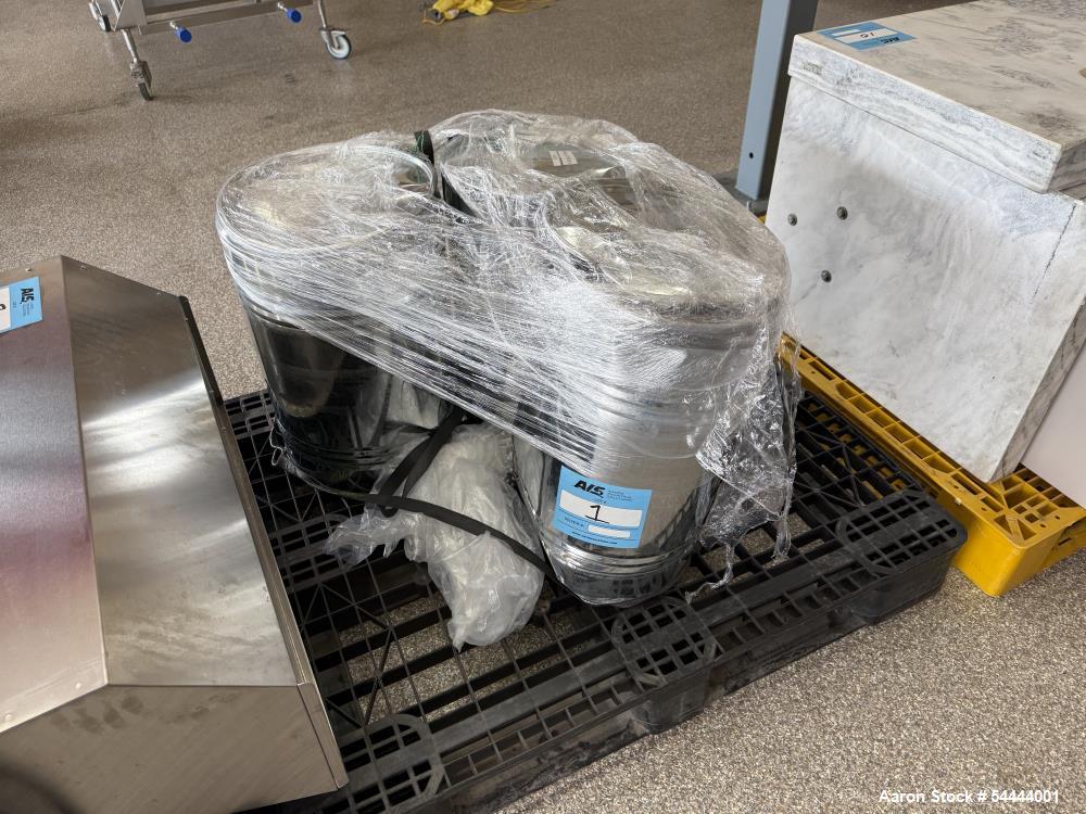 Unused Paul O Abbe Model BM-223 all-stainless-steel ball mill featuring a 2° tapered cylinder for full discharge and a split, hinged clamshell dry discharge housing. The cylinder measures 40 inches i...