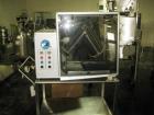 Used Patterson-Kelley Twin Shell Blender, 16 Quart, Stainless Steel. Rated 125/140 pounds a cubic foot maximum material density, with liquid feed bar, plastic enclosure with both shell and bar drives...