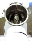 Used Patterson-Kelley Twin Shell Liquid-Solids Blender, 1 Cubic Foot Capacity, 304 Stainless Steel. Maximum material density 60 pounds per cubic foot. Solids bar with spray nozzle, driven by a 2hp, 3...