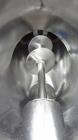Used Patterson-Kelley Twin Shell Liquid-Solids Blender, 1 Cubic Foot Capacity, 304 Stainless Steel. Maximum material density 60 pounds per cubic foot. Solids bar with spray nozzle, driven by a 2hp, 3...
