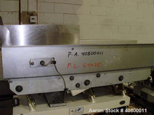 Used Heavy Duty Products Seasoning System, Consisting Of: (1) Acrison feeder, approximately 1 1/2" diameter x 42" long stainless steel tube and screw, includes controller. (1) Syntron vibratory feede...