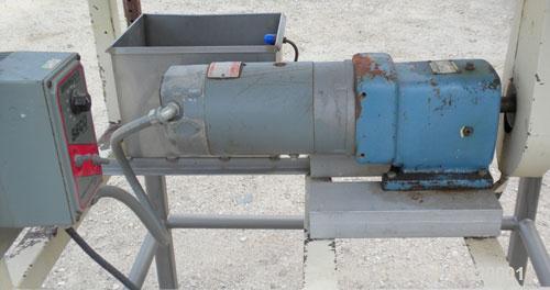 Used Horizontal Drum Tumbler, 316 Stainless Steel. Approximate 24" diameter x 48" long drum, intenal lifters, 17" long screen end section, 1/4" diameter holes. End outlet with chute. Driven by a 3/4 ...