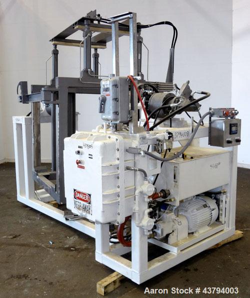 Used Tote Bulk Handling Systems Tote Blender. Will handle approximate 46" wide x 46" long x 48" tall totes. Top pneumatic hold downs. Driven by a 15hp, 3/60/230/460 volt, 1760 rpm hydraulic power pac...