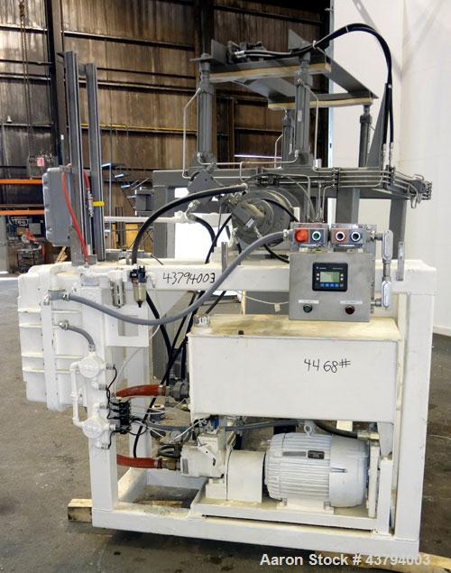 Used Tote Bulk Handling Systems Tote Blender. Will handle approximate 46" wide x 46" long x 48" tall totes. Top pneumatic hold downs. Driven by a 15hp, 3/60/230/460 volt, 1760 rpm hydraulic power pac...