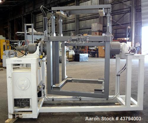 Used Tote Bulk Handling Systems Tote Blender. Will handle approximate 46" wide x 46" long x 48" tall totes. Top pneumatic hold downs. Driven by a 15hp, 3/60/230/460 volt, 1760 rpm hydraulic power pac...