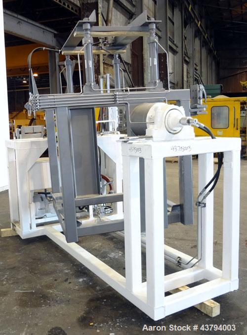 Used Tote Bulk Handling Systems Tote Blender. Will handle approximate 46" wide x 46" long x 48" tall totes. Top pneumatic hold downs. Driven by a 15hp, 3/60/230/460 volt, 1760 rpm hydraulic power pac...