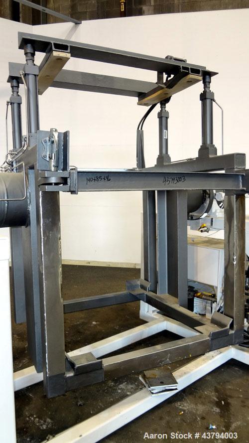 Used Tote Bulk Handling Systems Tote Blender. Will handle approximate 46" wide x 46" long x 48" tall totes. Top pneumatic hold downs. Driven by a 15hp, 3/60/230/460 volt, 1760 rpm hydraulic power pac...
