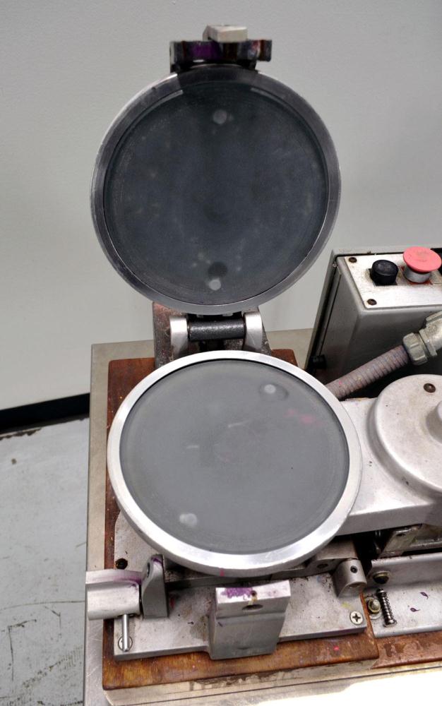 Used Hoover Color Corp. Automatic Muller, Model M5. Unit consists of (2) 7-1/2" Diameter glass plates, one of which rotates at a constant speed over a stationary plate causing shear forces to develop...