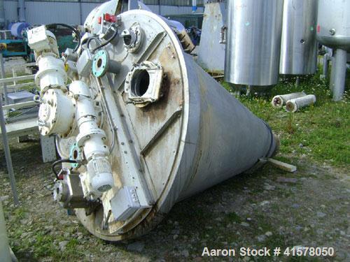 Used Hosokawa Conical Nauta Mixer, Model DBXE 1000, Approximately 35.3 cubic feet capacity (1000 liter), stainless steel. Approximately 68'' diameter x 85'' deep. Flat bolted top. Screw driven by a 2...