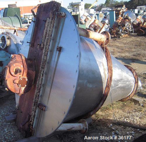 Used J.H. Day Nauta Mixer, 27 Cubic Feet, 304 Stainless Steel. 66" diameter x 72" high, polished internal, 1.5 hp, 5 hp 190/380 volt drives. Missing mixing screw, discharge, and pintle bearing.