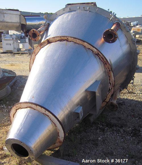 Used J.H. Day Nauta Mixer, 27 Cubic Feet, 304 Stainless Steel. 66" diameter x 72" high, polished internal, 1.5 hp, 5 hp 190/380 volt drives. Missing mixing screw, discharge, and pintle bearing.