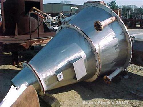 Used J.H. Day Nauta Mixer, 27 Cubic Feet, 304 Stainless Steel. 66" diameter x 72" high, polished internal, 1.5 hp, 5 hp 190/380 volt drives. Missing mixing screw, discharge, and pintle bearing.