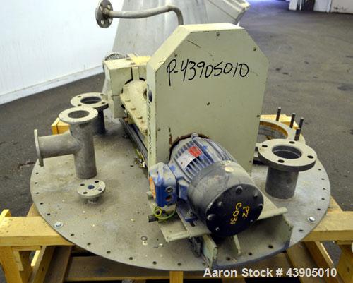 Used Vrieco Nauta Mixer, Approximately 6.9 Cubic Feet Working Capacity (195 Liter), 304 Stainless Steel.  Approximately 48" diameter x 66-1/2" cone height, bolt on flat top with 1", 3", (2) 4", 10" o...