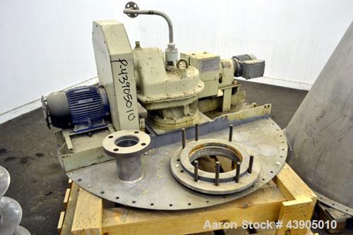 Used Vrieco Nauta Mixer, Approximately 6.9 Cubic Feet Working Capacity (195 Liter), 304 Stainless Steel.  Approximately 48" diameter x 66-1/2" cone height, bolt on flat top with 1", 3", (2) 4", 10" o...