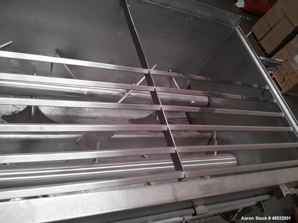 Used CSE Twin Shaft Paddle Mixer. 104 cubic foot working capacity. Heavy duty, stainless steel construction. 17' 8" x 5" x 8 4", total weight: 6,000 lbs. Sliding partial cover arrangement that cantil...