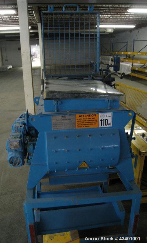 Used BHS Twin Shaft Batch Mixer.  It has a 60 liter capacity in the hopper and is stainless steel.  Footprint is 3' x 3' and 5' high.  It has a VFD inside a control panel and manual.  The mixer is 3 ...