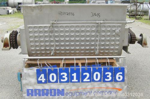 Used Custom Metalcraft Dual Shaft Paddle Mixer, 15 cubic feet, model DRB-15, 304 stainless steel. Dimpled jacketed tapered trough 39'' wide x 48'' long x 25'' deep. (10) approximately 4 1/2'' wide x ...