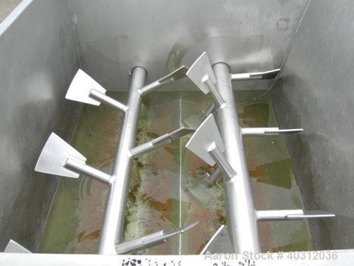 Used Custom Metalcraft Dual Shaft Paddle Mixer, 15 cubic feet, model DRB-15, 304 stainless steel. Dimpled jacketed tapered trough 39'' wide x 48'' long x 25'' deep. (10) approximately 4 1/2'' wide x ...