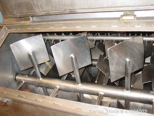 Used Halvor Forberg Twin Shaft Fluidizer, Model 795, Stainless Steel. Chamber approximately 52’’ long x 60’’ wide. (2) 3-1/2’’ diameter shafts with (14) paddles per shaft,  paddles 9-1/4’’ x 10’’ wel...