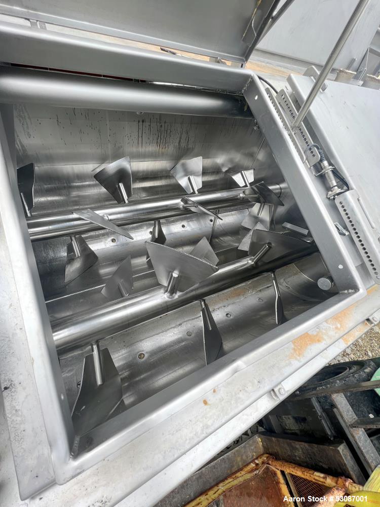Used Karl Schnell Paddle Mixer, Stainless Steel. Approximately 140 cubic feet, 4000 Liter capacity. Has stainless steel feed hopper with dual screw conveyors, driven by (2) Approximate 5.4HP drive ge...