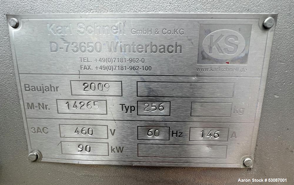 Used Karl Schnell Paddle Mixer, Stainless Steel. Approximately 140 cubic feet, 4000 Liter capacity. Has stainless steel feed hopper with dual screw conveyors, driven by (2) Approximate 5.4HP drive ge...