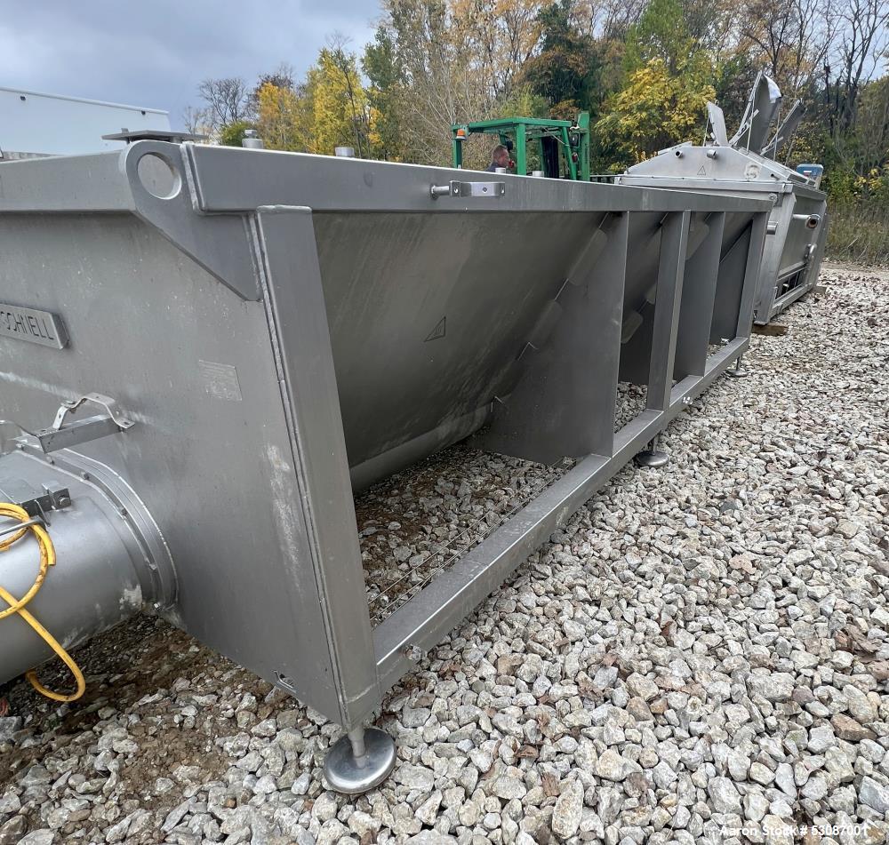 Used Karl Schnell Paddle Mixer, Stainless Steel. Approximately 140 cubic feet, 4000 Liter capacity. Has stainless steel feed hopper with dual screw conveyors, driven by (2) Approximate 5.4HP drive ge...