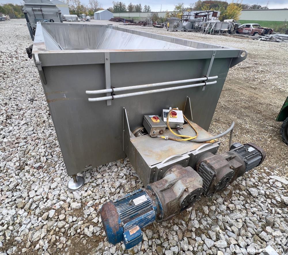 Used Karl Schnell Paddle Mixer, Stainless Steel. Approximately 140 cubic feet, 4000 Liter capacity. Has stainless steel feed hopper with dual screw conveyors, driven by (2) Approximate 5.4HP drive ge...